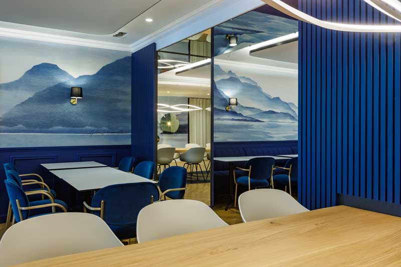 The Bleu Impérial restaurant, set for a meal with the lake beyond